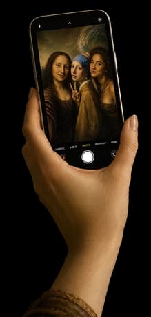 Floothink — hand holding a phone photographing classic paintings